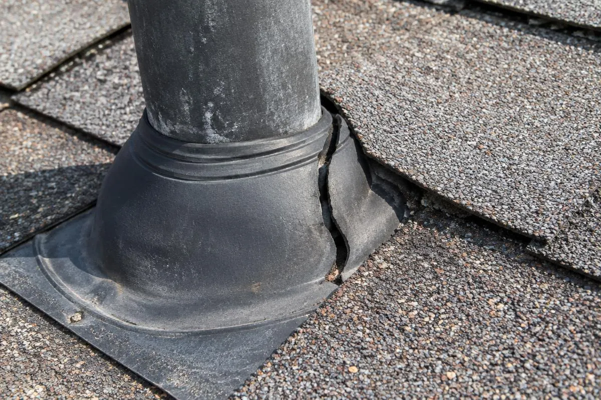 Pipe boot and adjoining shingles