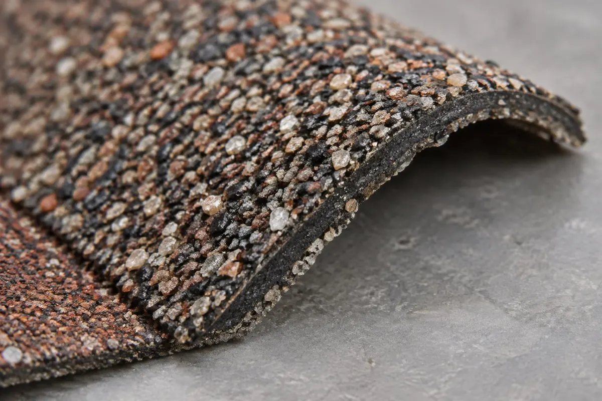 Close view of a shingle surface and edge