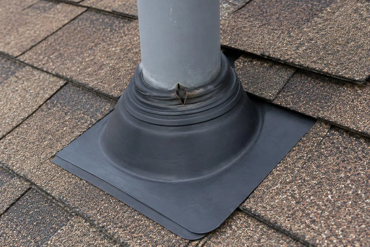 A split flexible seal where a plumbing vent passes through a roof boot