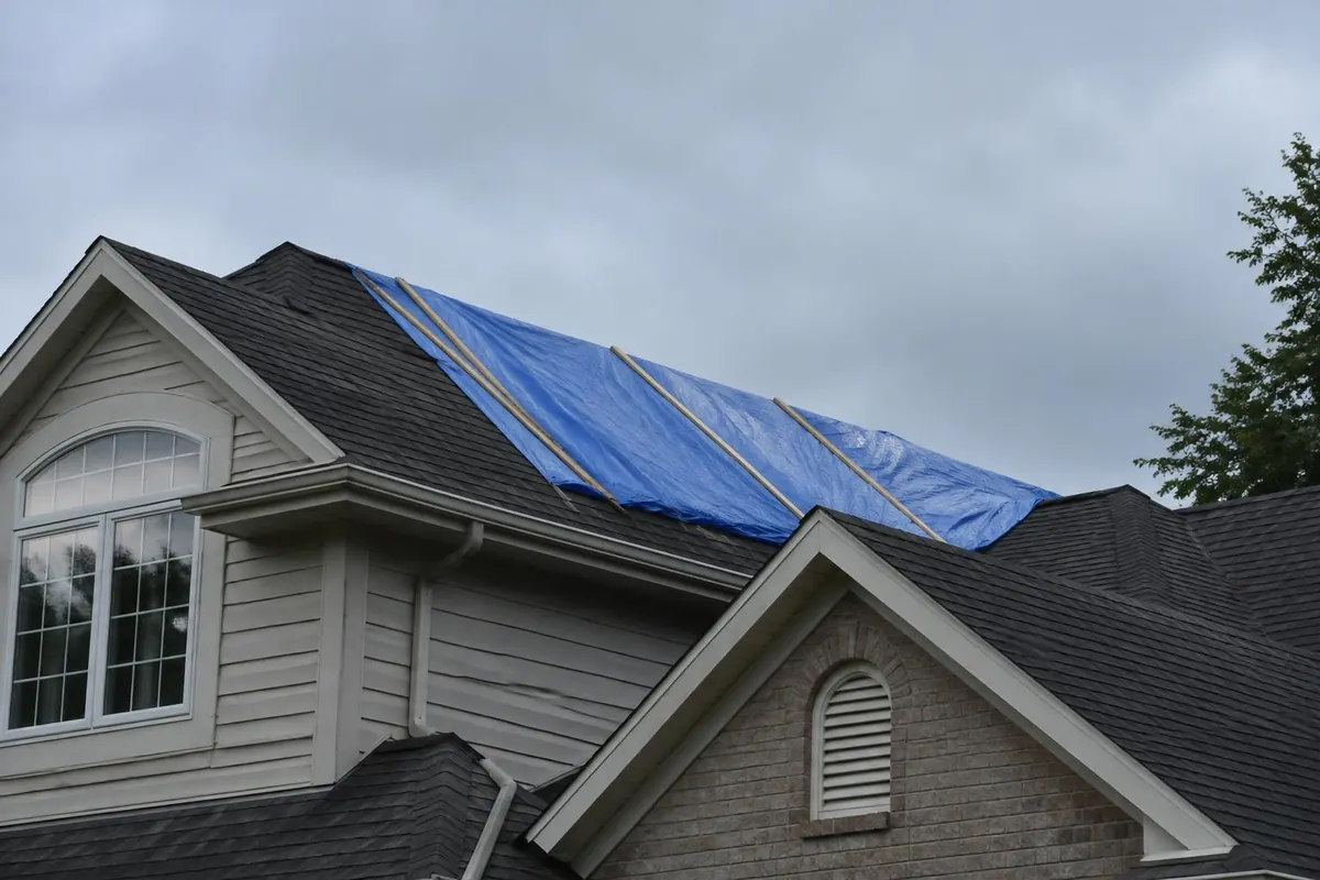 Temporary reinforced roof covering viewed from the ground with its protected area visible